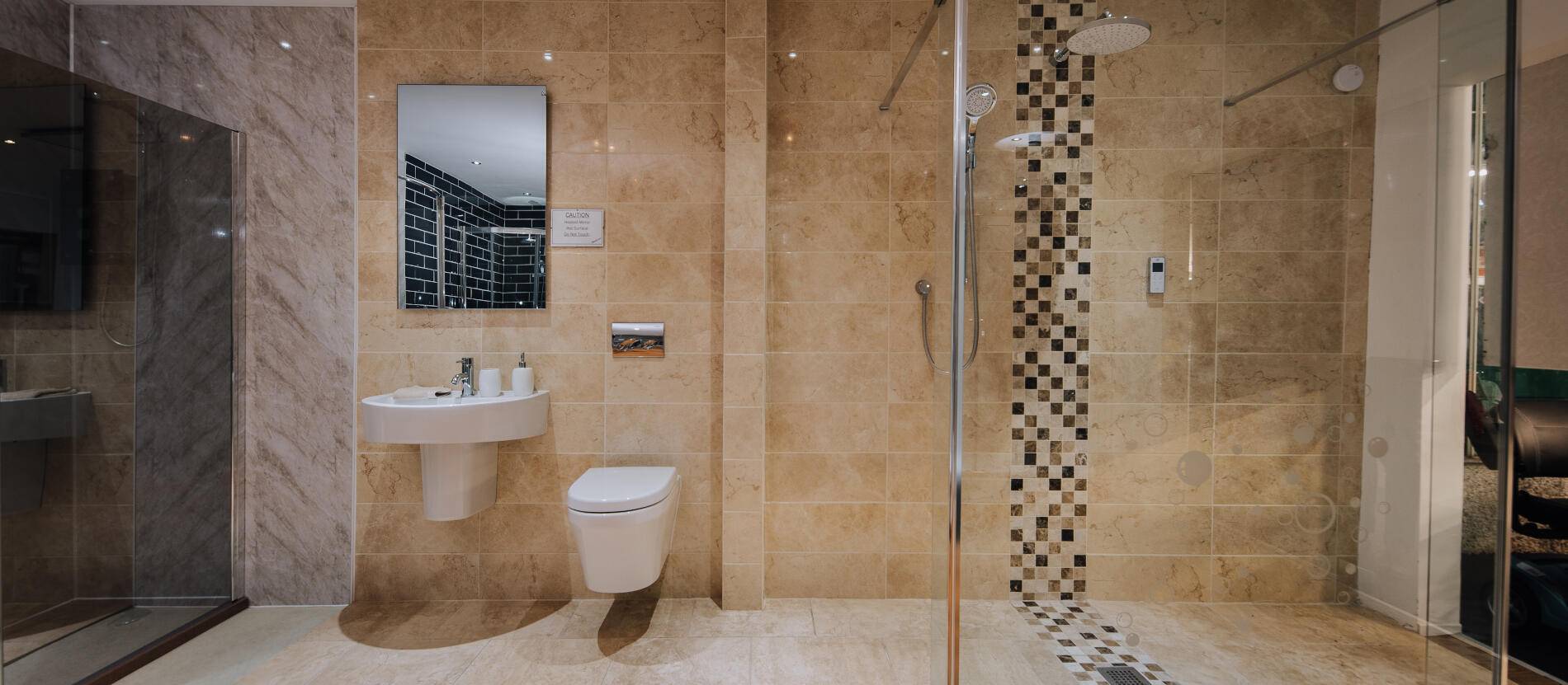 Walk in shower with big clear glass door and toilet and sink