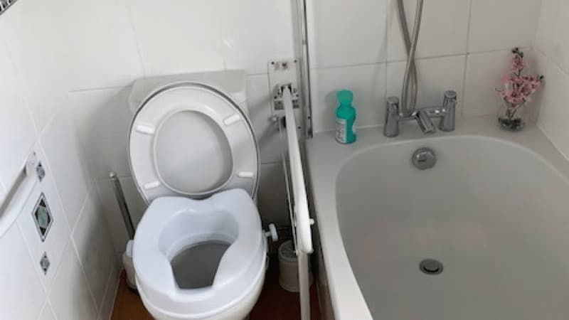 toilet with support rails, bath